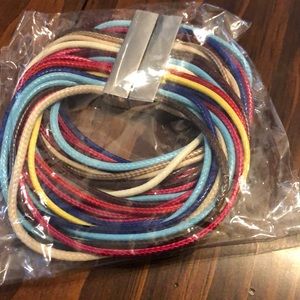 Multi-color bracelet with metal clasp